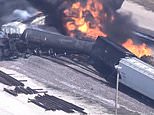 Freight train derails and erupts into flames along tracks in Illinois 