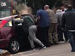 Moment bystanders rush to lift a car off a teenage cyclist after a hit-and-run