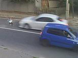 Ukrainian boy is hit by a car and sent flying - then gets up before running back to the pavement 